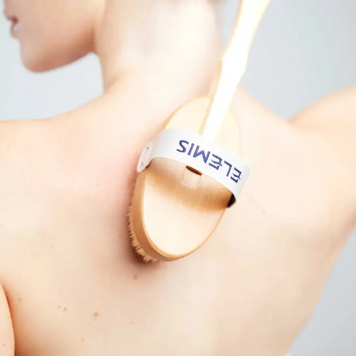 Person using a brush labeled &