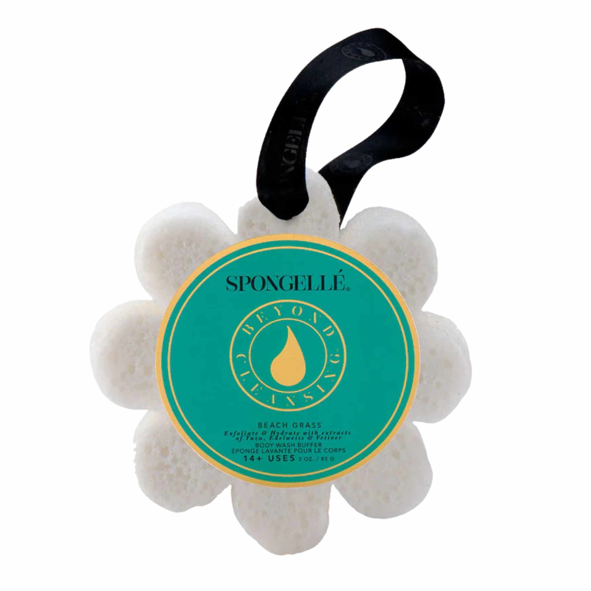 A flower-shaped Spongellé bath sponge with a label reading &