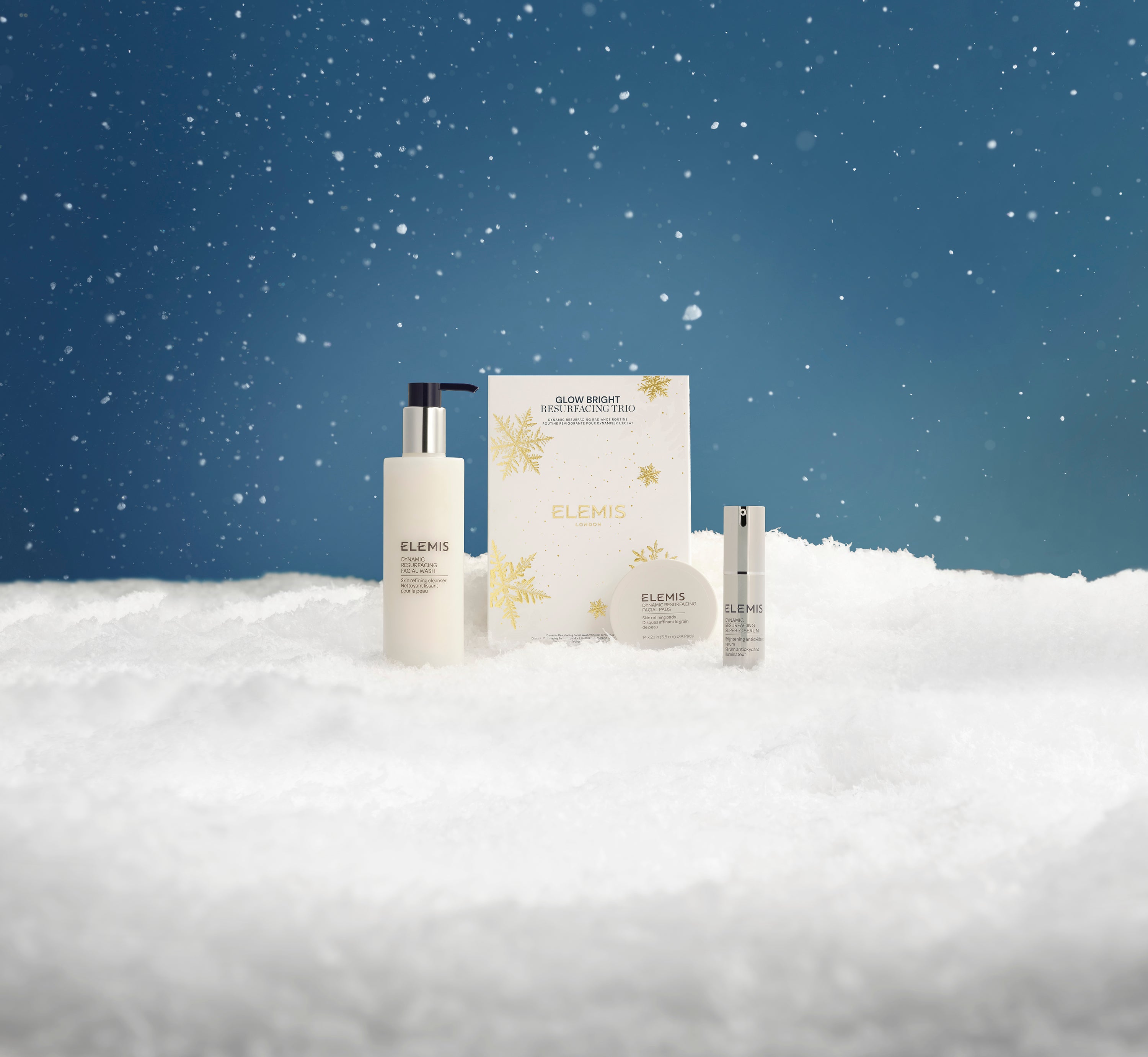 Elemis skincare products on a snowy landscape with a starry night sky.