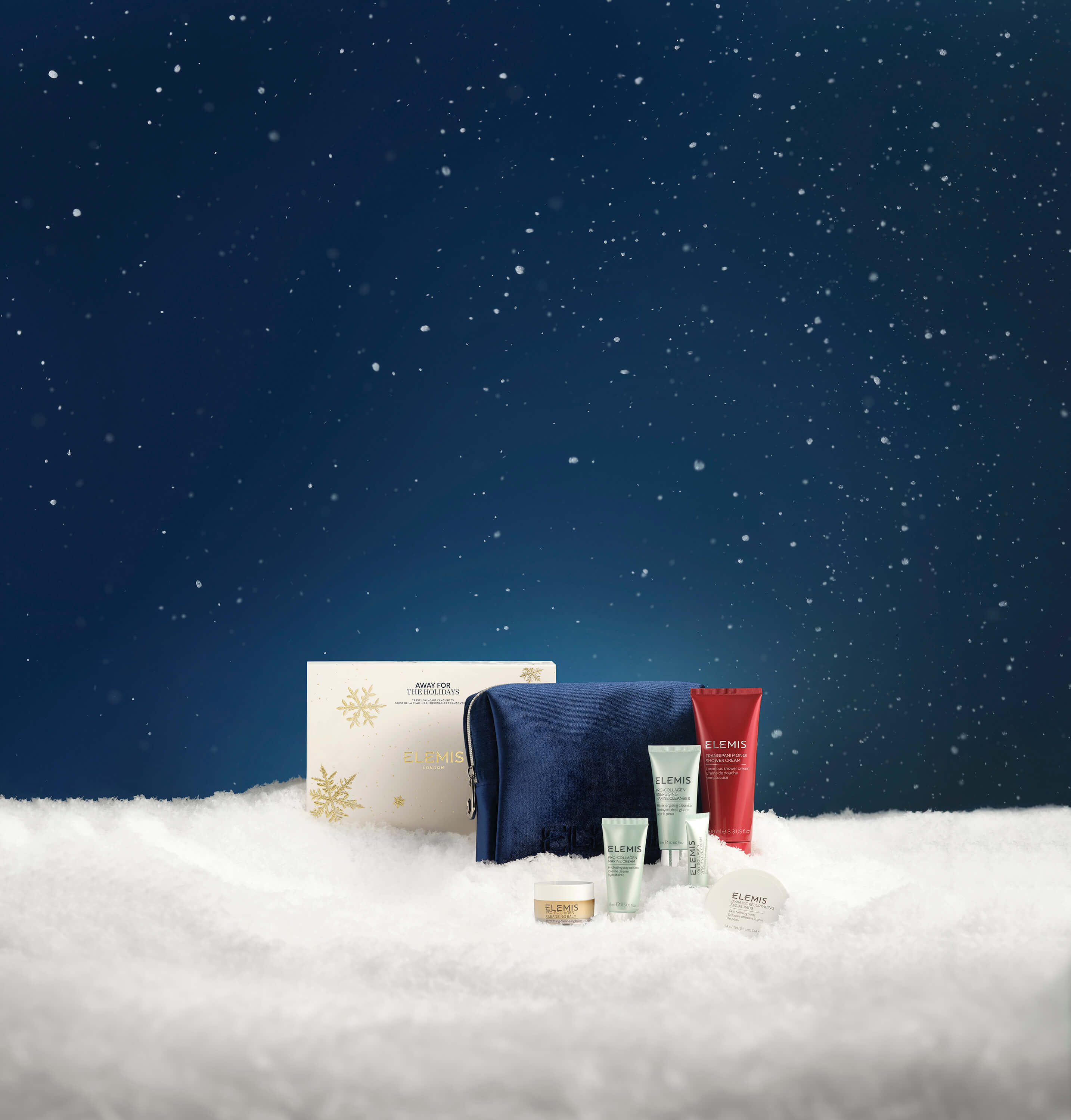 Cosmetic products on a snowy surface with a starry night sky background