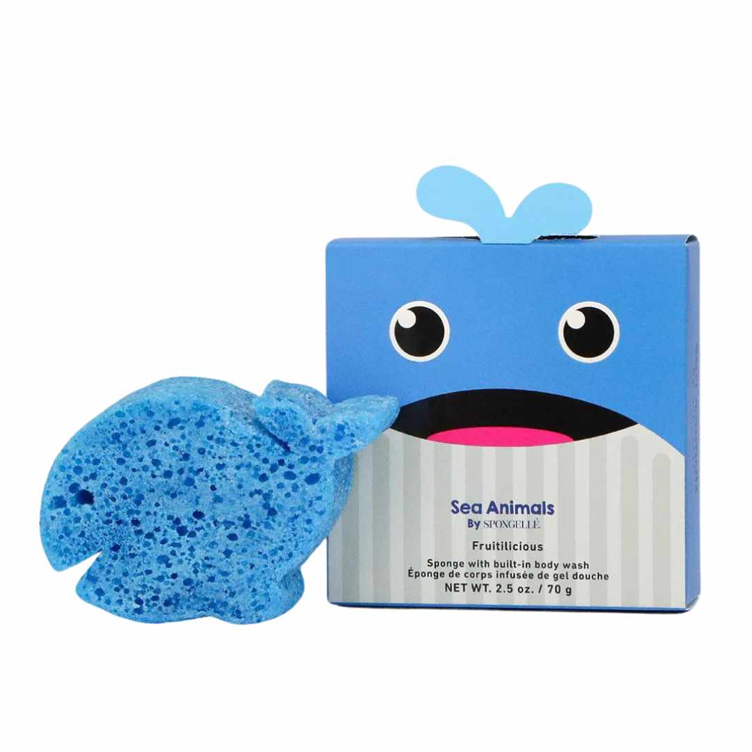 A blue sponge in the shape of a whale with a friendly facial expression, next to its packaging box labeled &