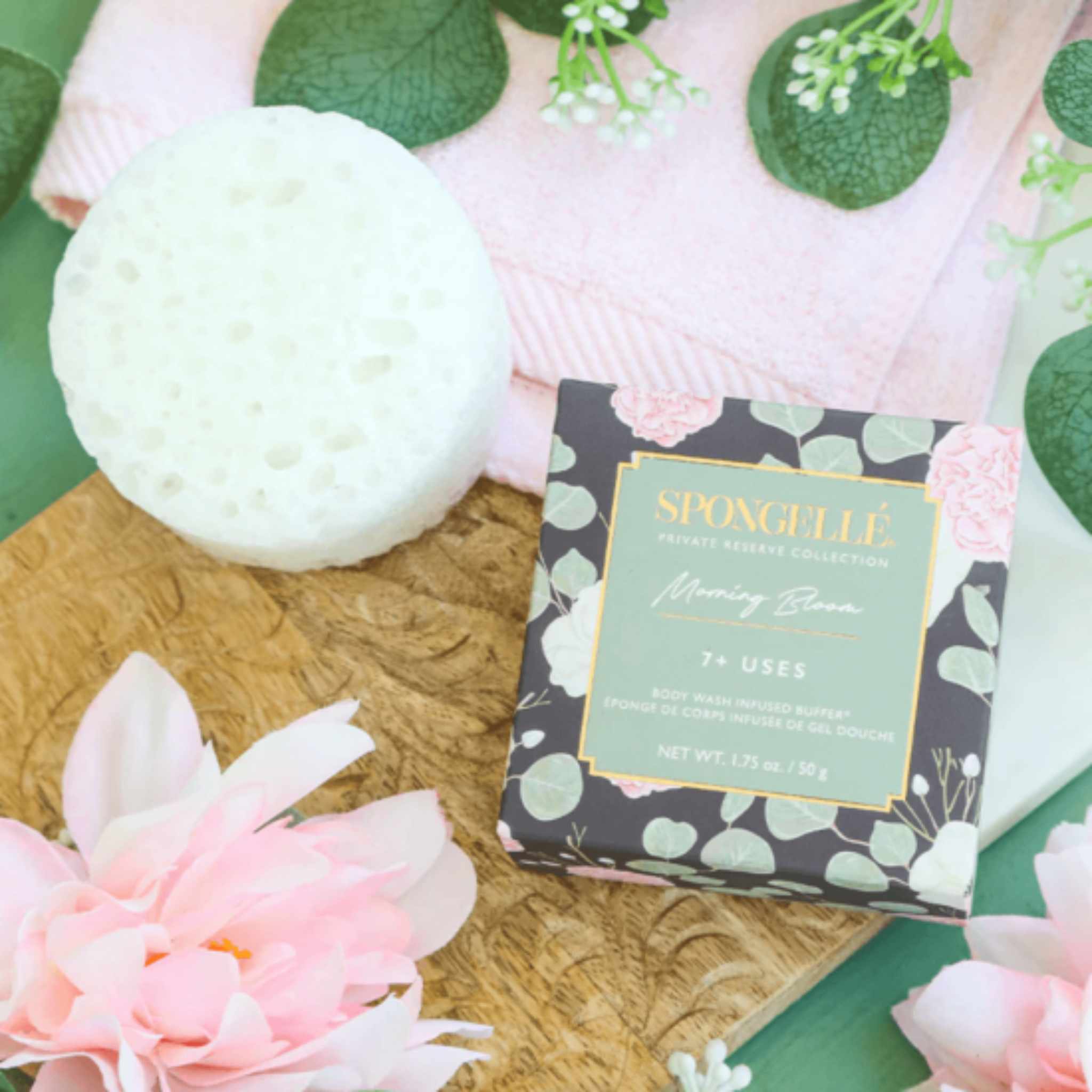 Circle shaped white sponge next to Spongelle box