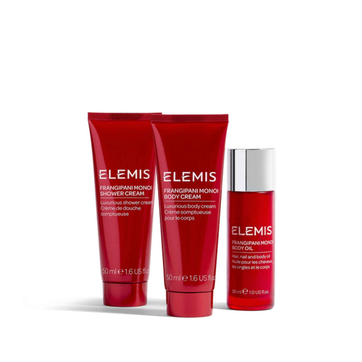Three Elemis Frangipani Monoi body care products on a white background: a shower cream tube, a body cream tube, and a body oil bottle.