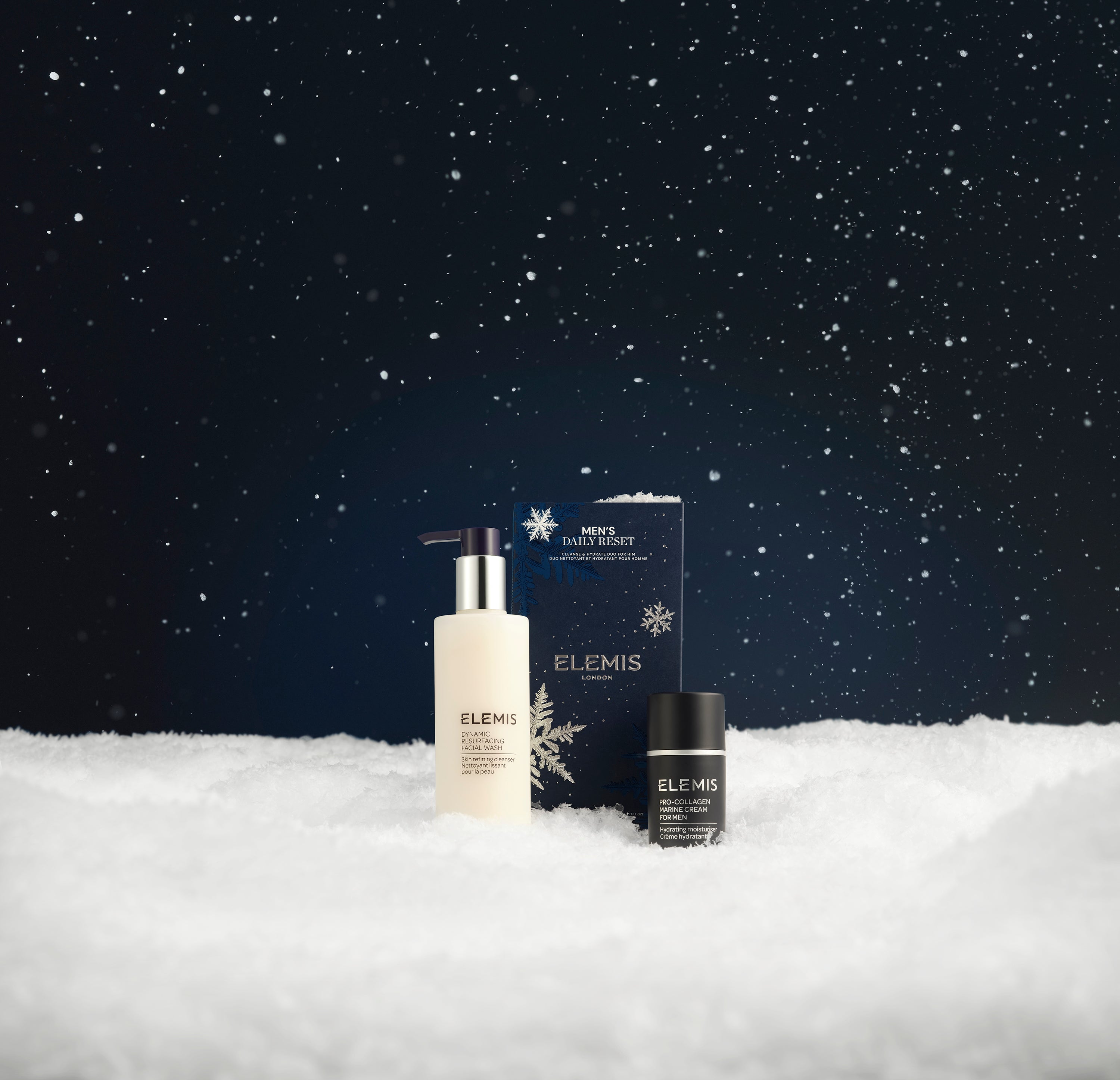 Elemis skincare products on a snowy landscape with a dark sky.