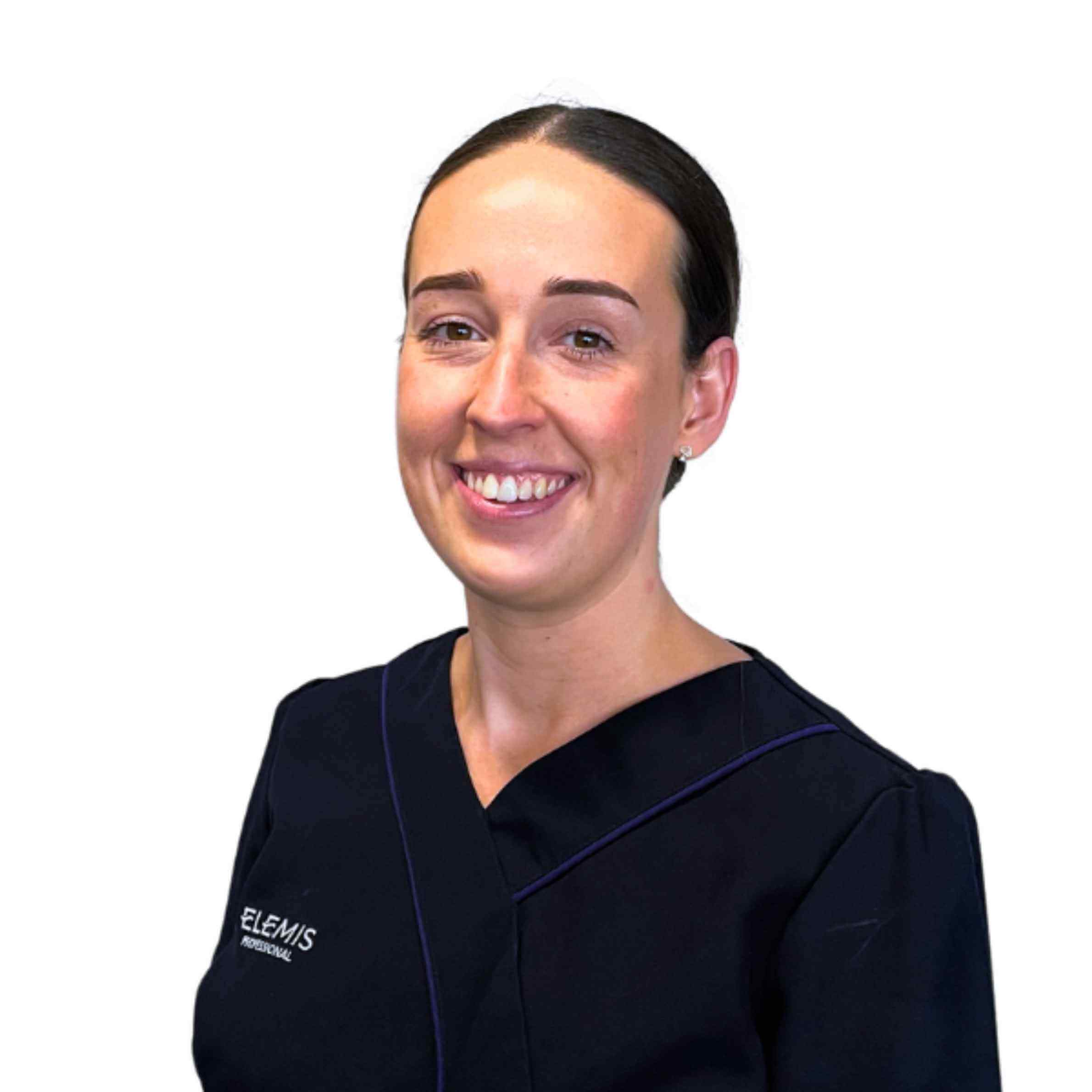 Woman wearing a black Elemis scrub on a white background