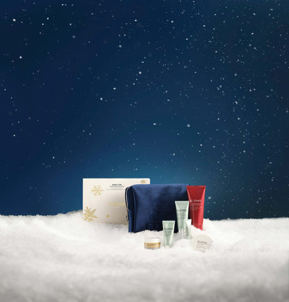 Cosmetic products on a snowy surface with a starry night sky background