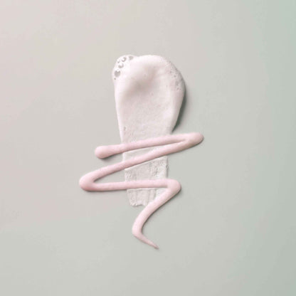 Elemis Hydrating Cleanser texture shot on grey background