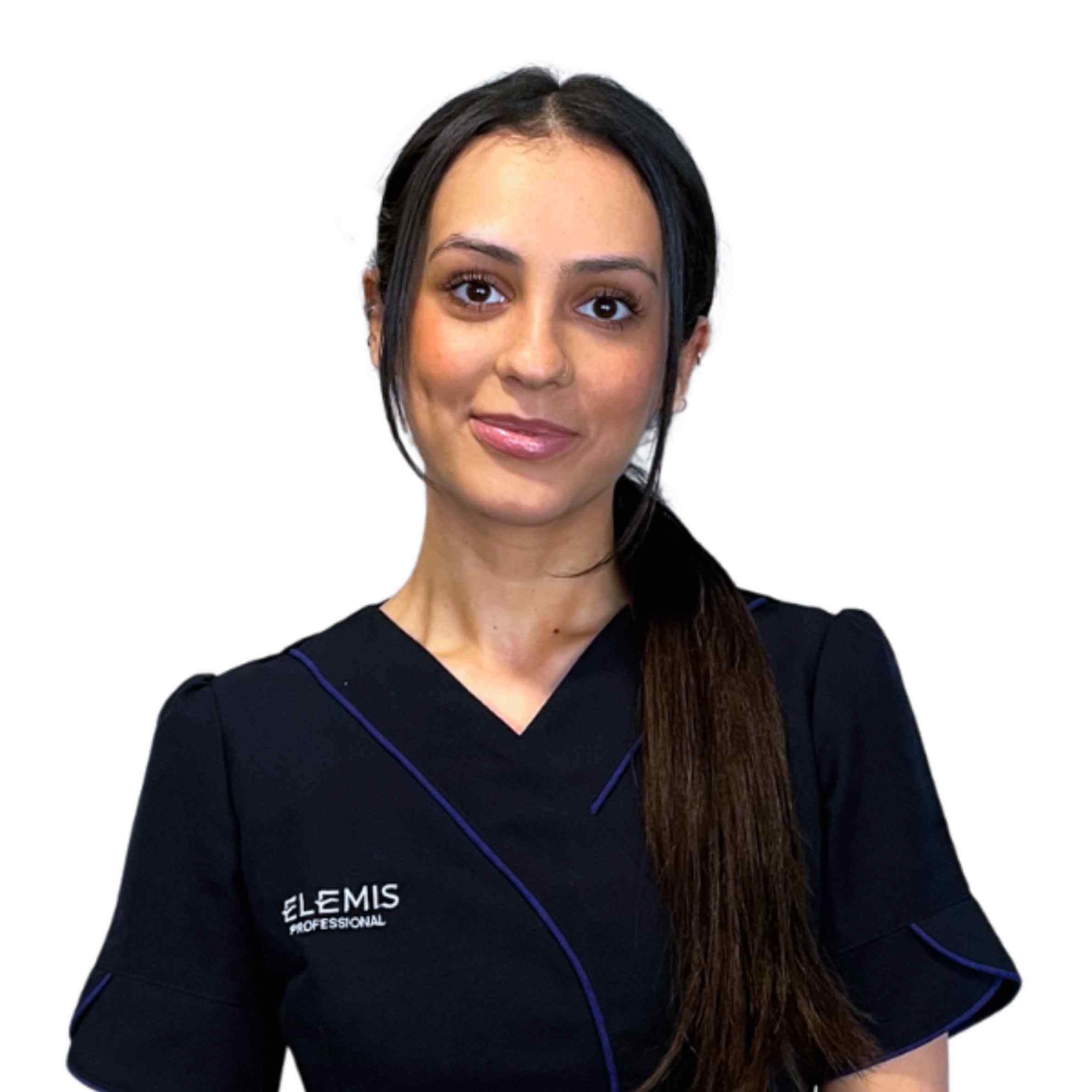 Woman wearing anElemis Professional uniform on a white background