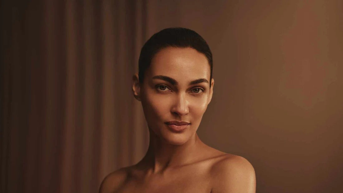 Woman with a short haircut against a plain background