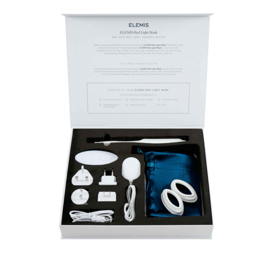 ELEMIS Red Light Therapy Set in its open presentation box, showing white devices, accessories, a blue storage pouch, and a white power cord inside a black tray.