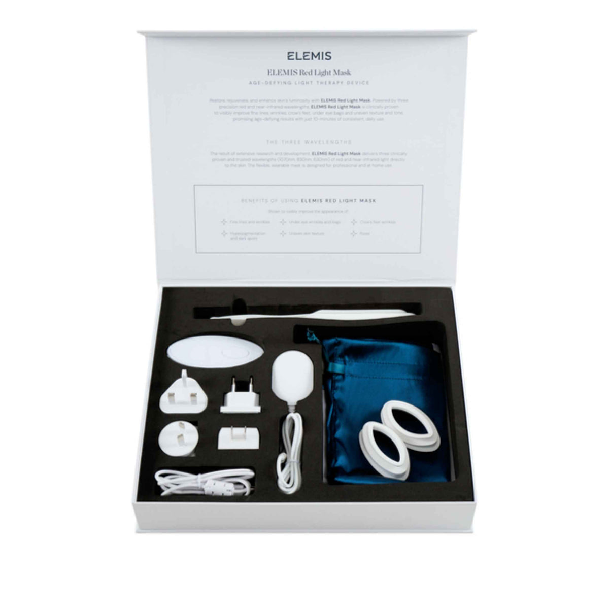 ELEMIS Red Light Therapy Set in its open presentation box, showing white devices, accessories, a blue storage pouch, and a white power cord inside a black tray.