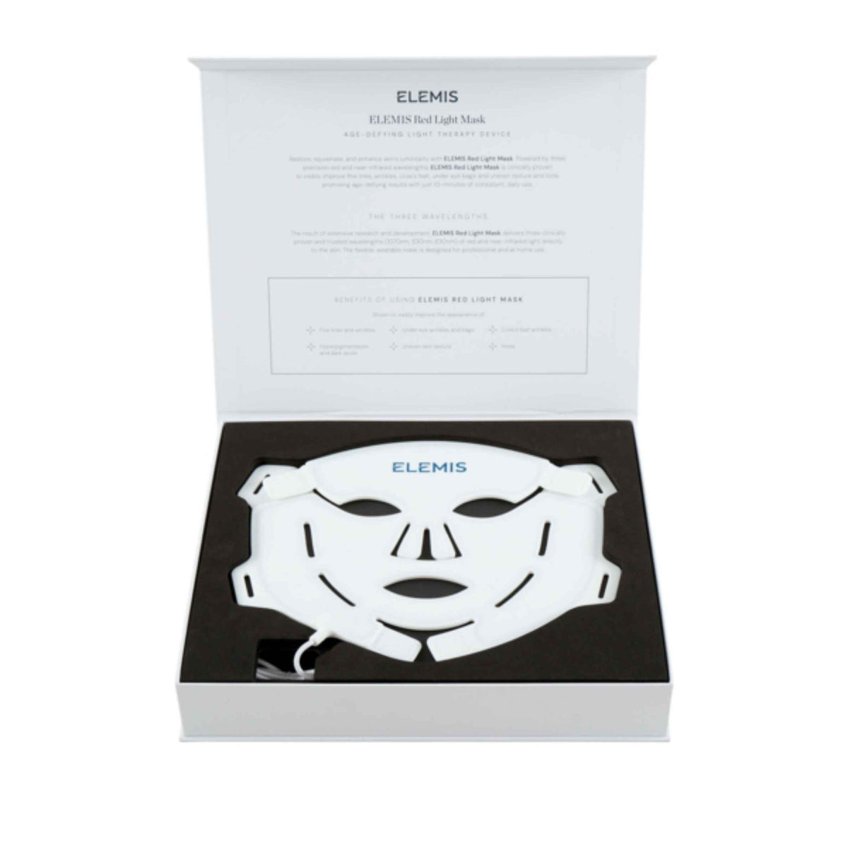 A white Elemis LED light therapy face mask presented inside its open white and black gift box, with the product name and description printed on the inside lid.