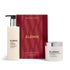 Elemis Resurface & Glow Duo skincare set featuring a Dynamic Resurfacing Facial Wash pump bottle, a box with red wavy pattern and gold lettering, and a Zoning Resurfacing Facial Pads jar with a silver lid, on a white background.